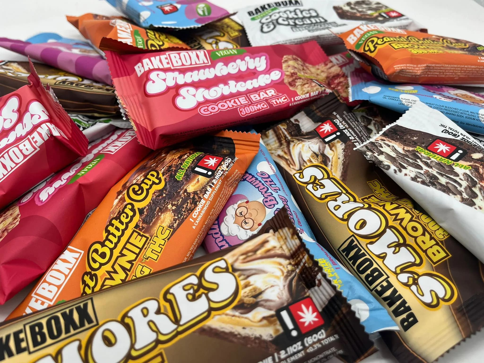 Various thc brownie cookie and thc bars from BakeBoxx, all having different flavors, like the Strawberry Shortcake, the S'mores, and the Peanut Butter Cup, and a couple of others